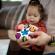Jucarie senzoriala curiosity clutch twist & pop rattle teether baby einstein