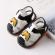 Sandalute alb cu negru cu piuitoare - litera m (marime disponibila: 3-6 luni
